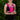 A person wearing a neon pink and black phone holder vest and shorts with reflective details. They are smiling and holding a phone.
