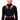 A person wearing a black vest with pink and black adjustable straps and a Velcro mounting pad.