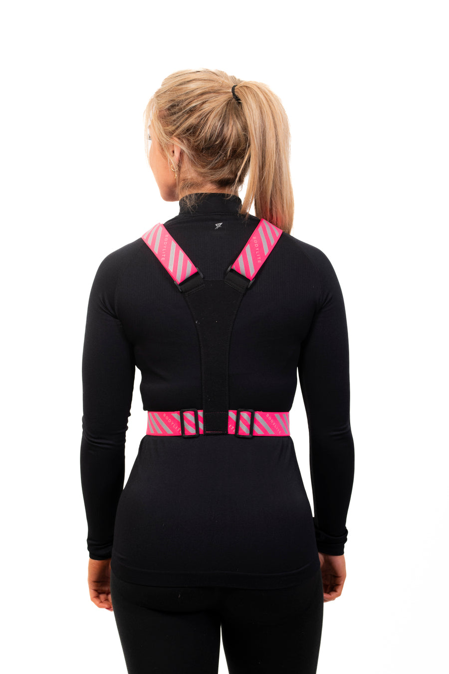 The pink nightviz vest from the back with reflective detailing